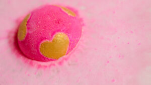 Close up of Heart Beat bath bomb dissolving in water