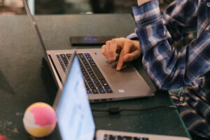 Close up of laptop screen next to a Lush bath bomb