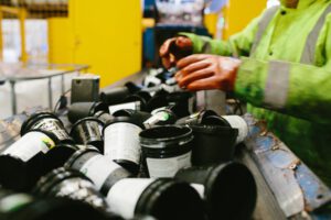 Sorting Lush black pots in the Lush Greenhub in Poole, ready for recycling