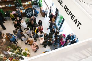 A view from above showing customers queuing and entering the Lush Liverpool shop floor