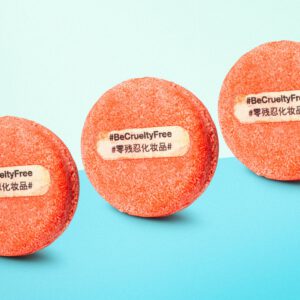 3 New shampoo bars with #BeCrueltyFree written on them stand against a blue background.